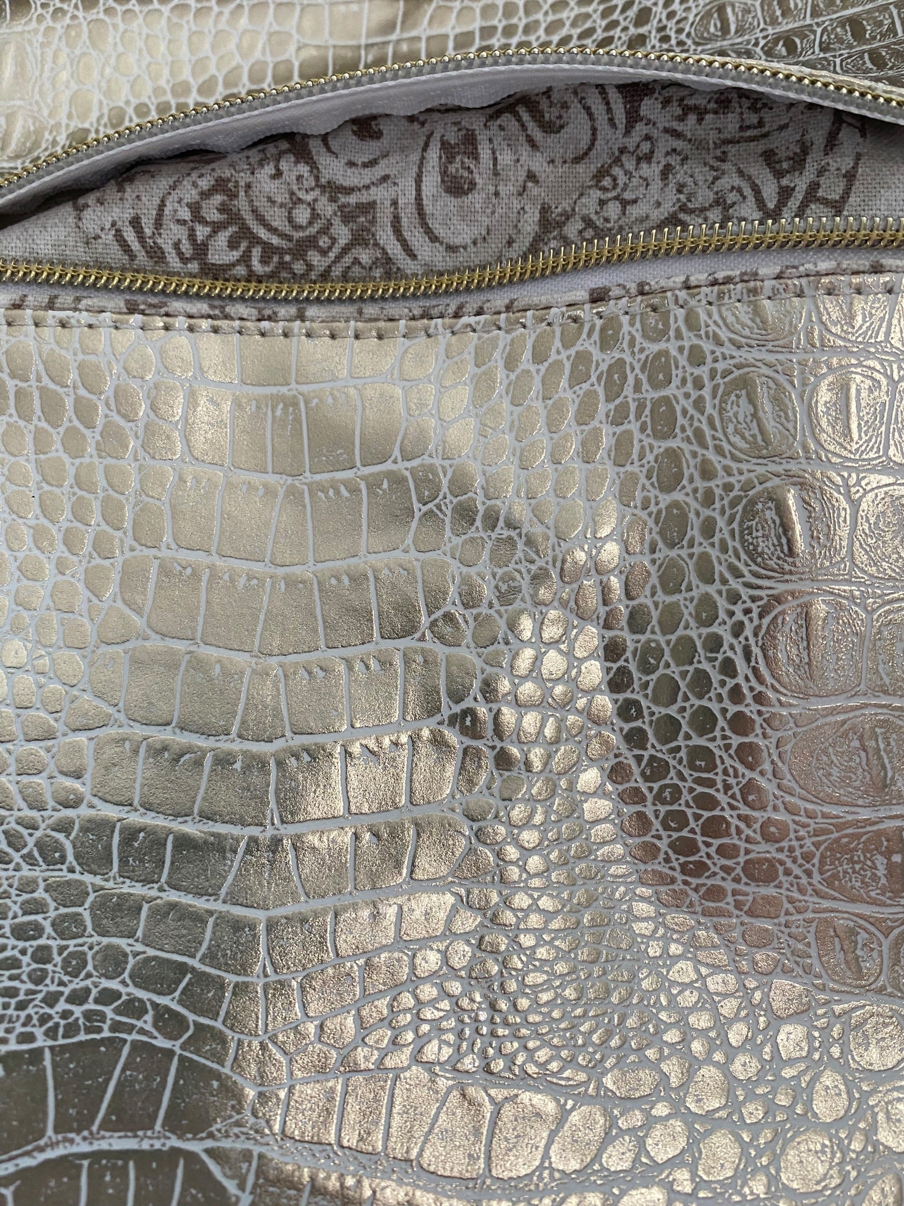 Oversized vinyl Hobo bag, pockets, 24” top zipper 17w x 33h gold & cream